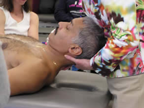 A man is being examined by an instructor.